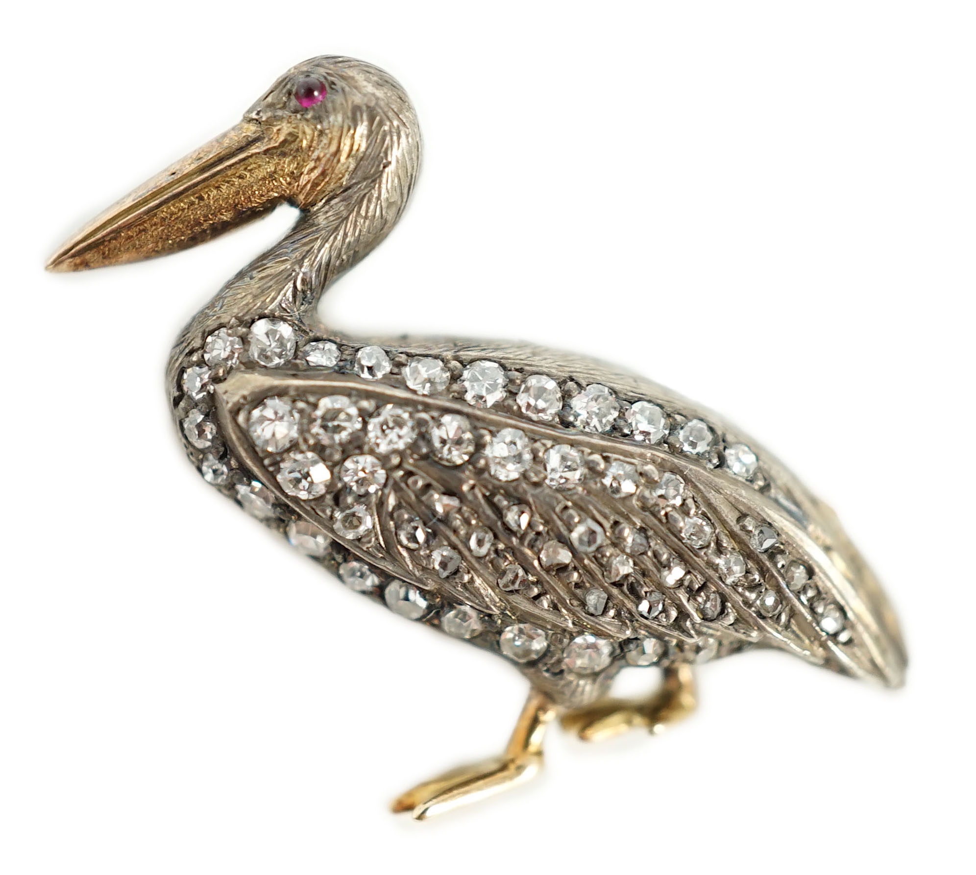 A Victorian style diamond encrusted and ruby set brooch, modelled as a pelican